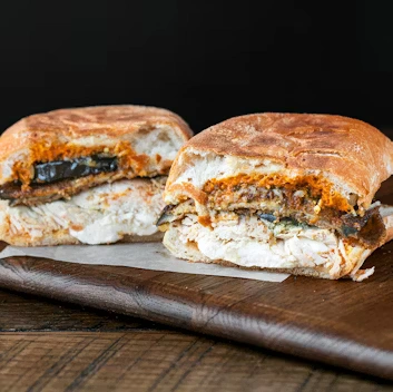 EGGPLANT CHICKEN PARM PANINI